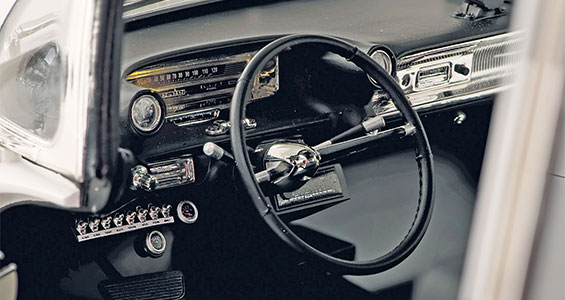 Inside, the hidden phone is revealed in the dashboard
