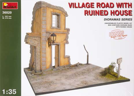 Village road with ruined house