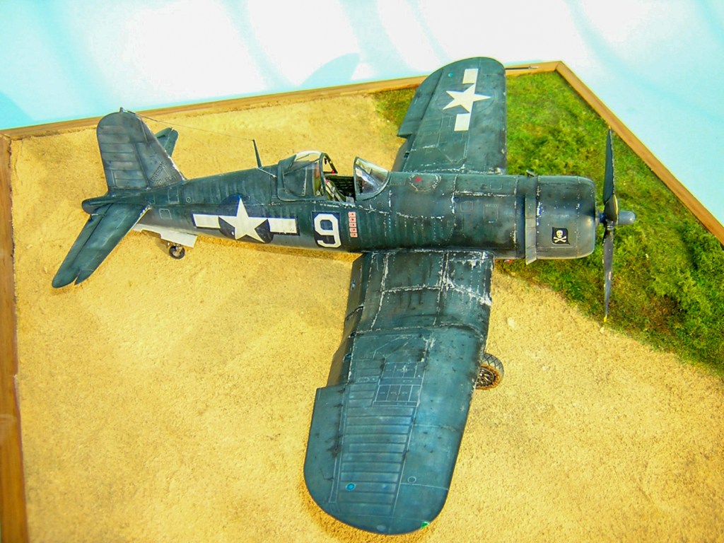 Brush-painting a war-weary Corsair