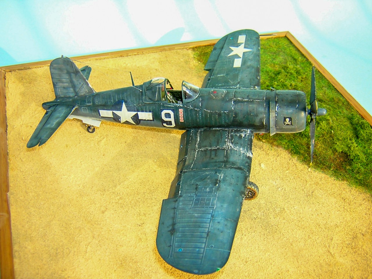 Brush-painting a war-weary Corsair